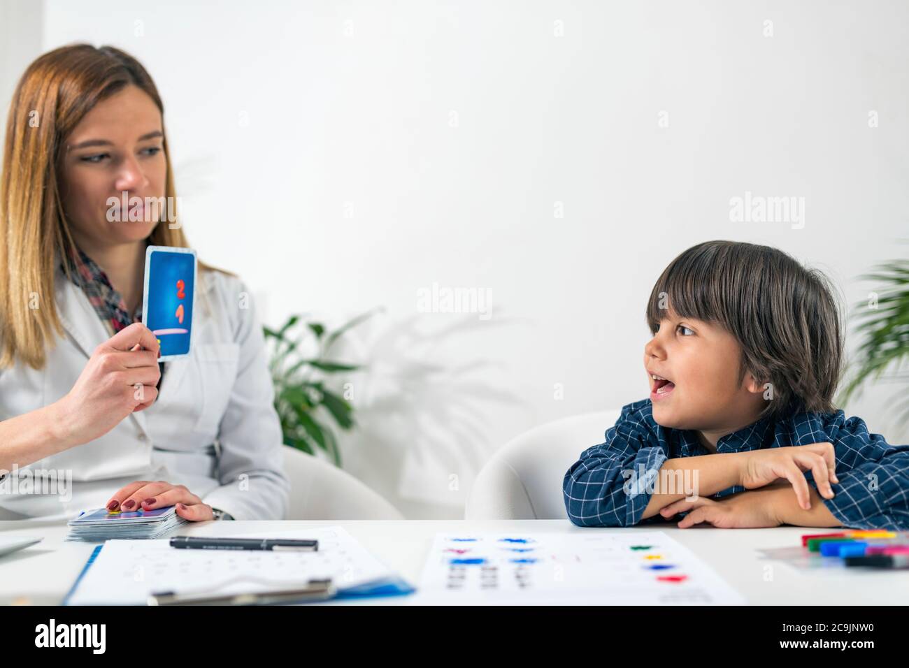 Psychology test for children. Toddler undergoing a logic test. Stock Photo