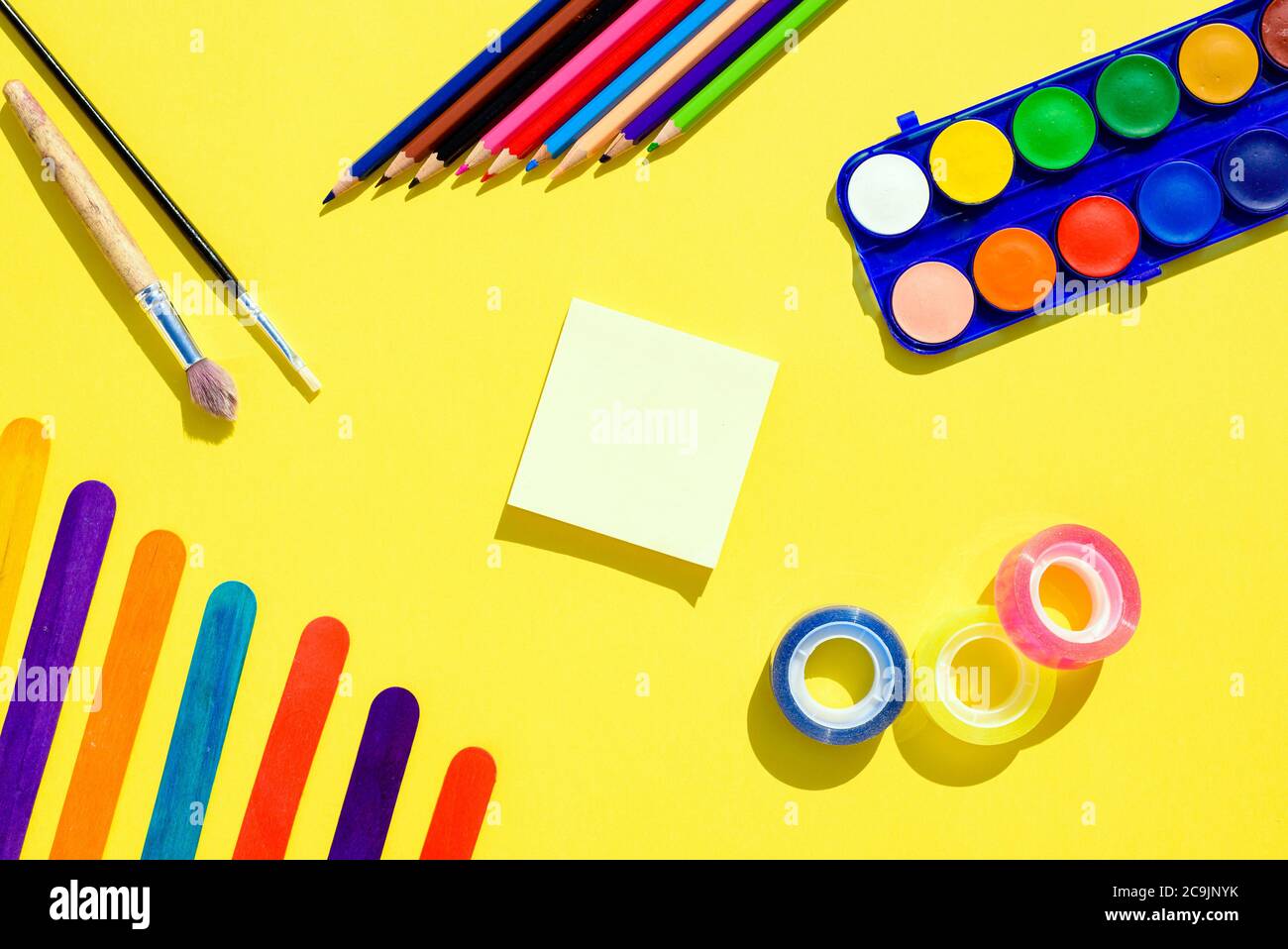 Colorful flat lay background with craft supplies on the way back to ...