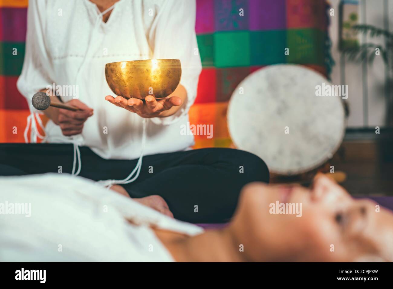 Tibetan singing bowl in sound meditation therapy. Stock Photo