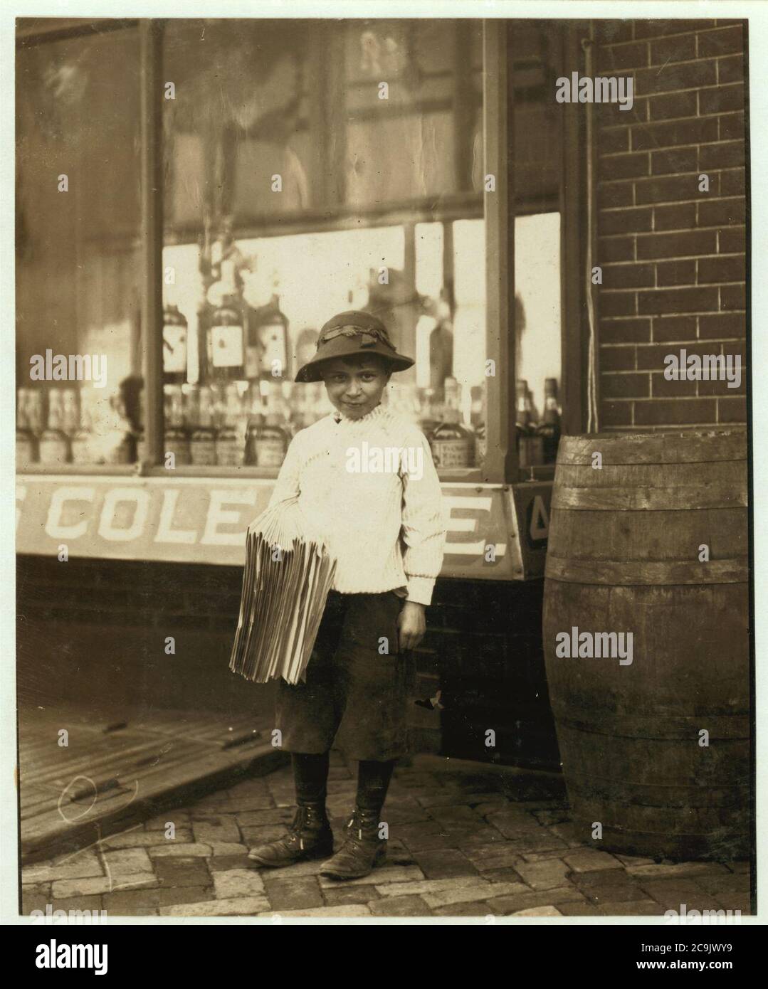 James Morgan, 119 French St. Newsboy. 9 years of age. Selling newspaper 4 years. Average earnings 50 cents per week. Selling papers own choice. Don't smoke. Visits saloons. Works 6 hours per Stock Photo