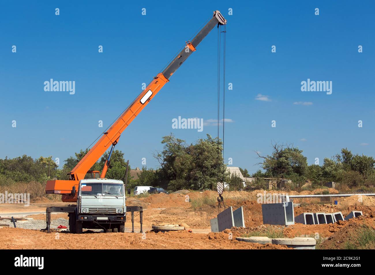 truck crane with hydraulic system lifts concrete structures for
