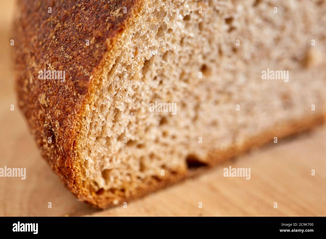 Loaf of sourdough, whole grain bread sliced open to reveal the inner crumb. Pennsylvania, USA Stock Photo