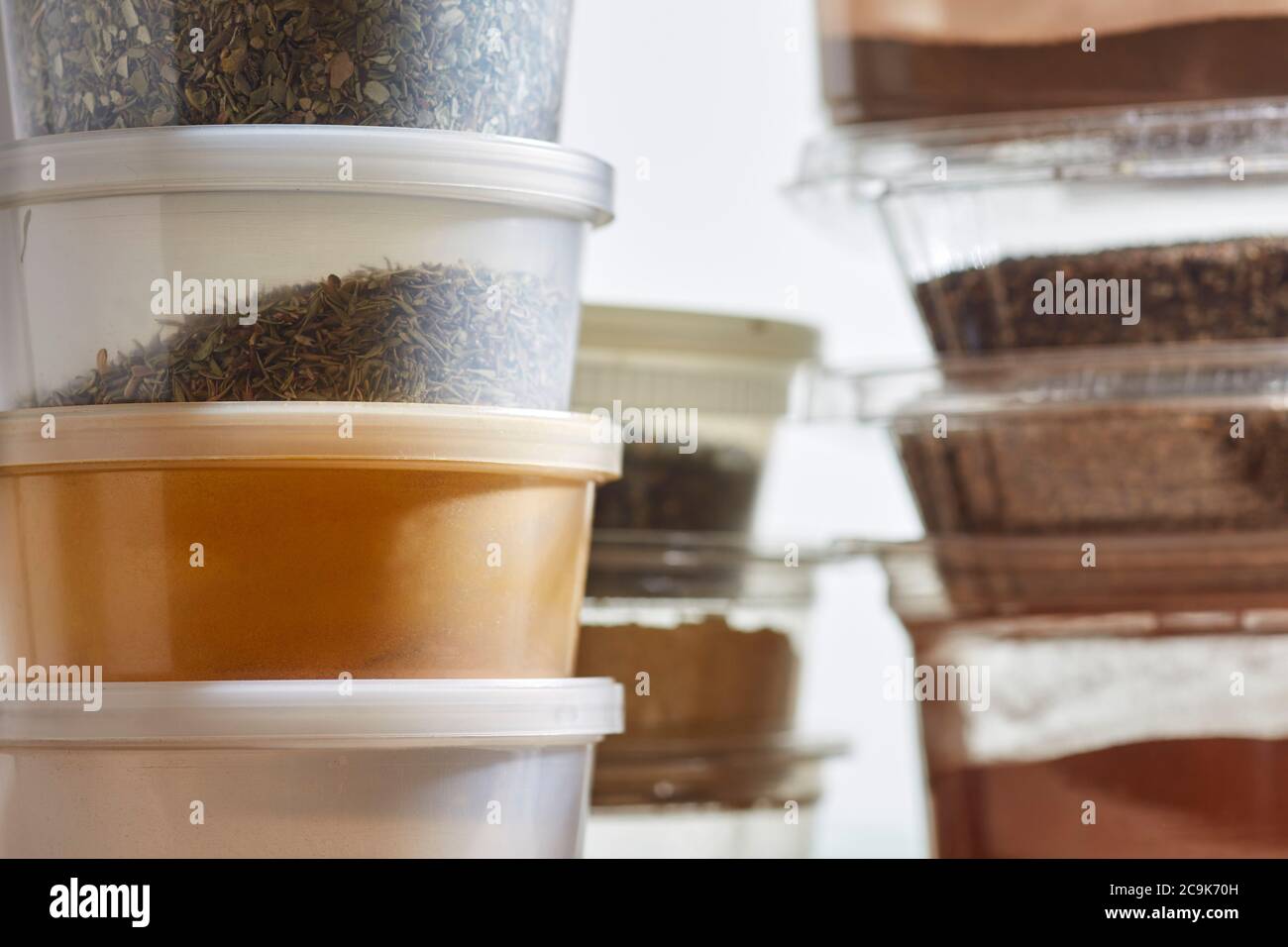 Amish bulk food items. Spices are packed in plastic containers at Amish bulk food stores in Pennsylvania, USA Stock Photo