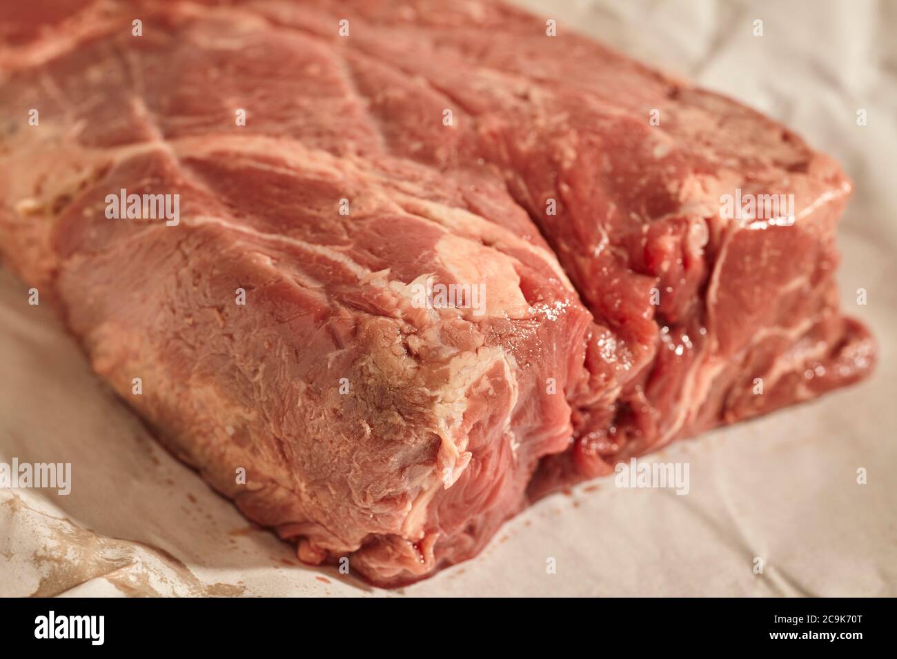 A raw, fresh chuck roast of beef from an artisan butcher in central Pennsylvania, USA. This is sometimes called 'stewing steak.' Stock Photo