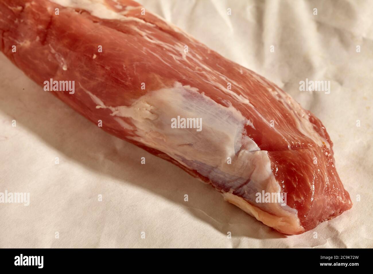 a fresh, raw whole pork tenderloin, sometimes called a fillet mignon of pork, from an artisan butcher shop in Pennsylvania, USA Stock Photo