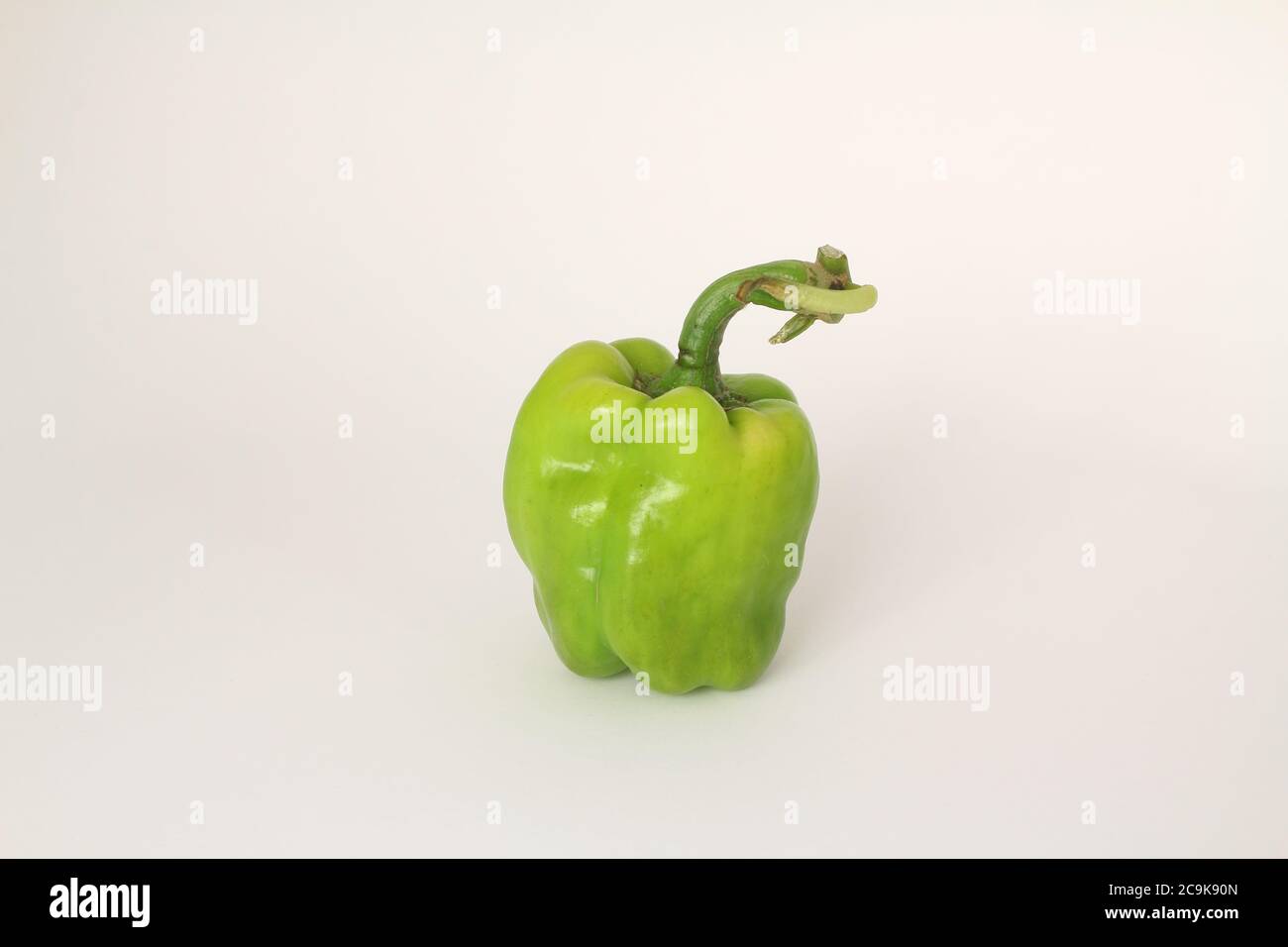 Sweet green bell pepper on white isolated background with clipping path