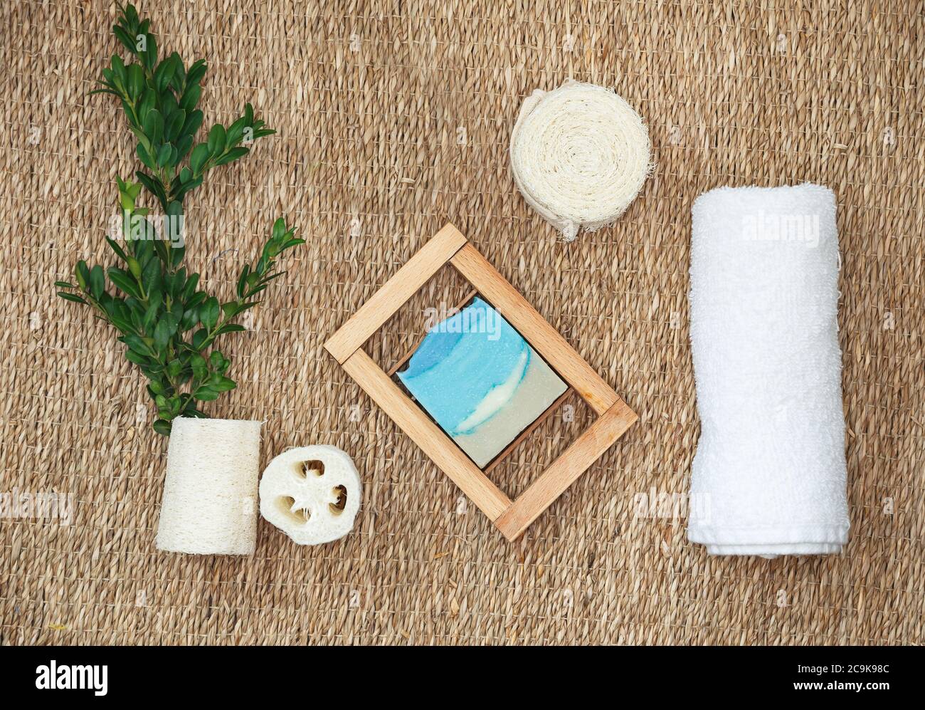 Various spa related objects on straw background. Spa accessories Stock Photo