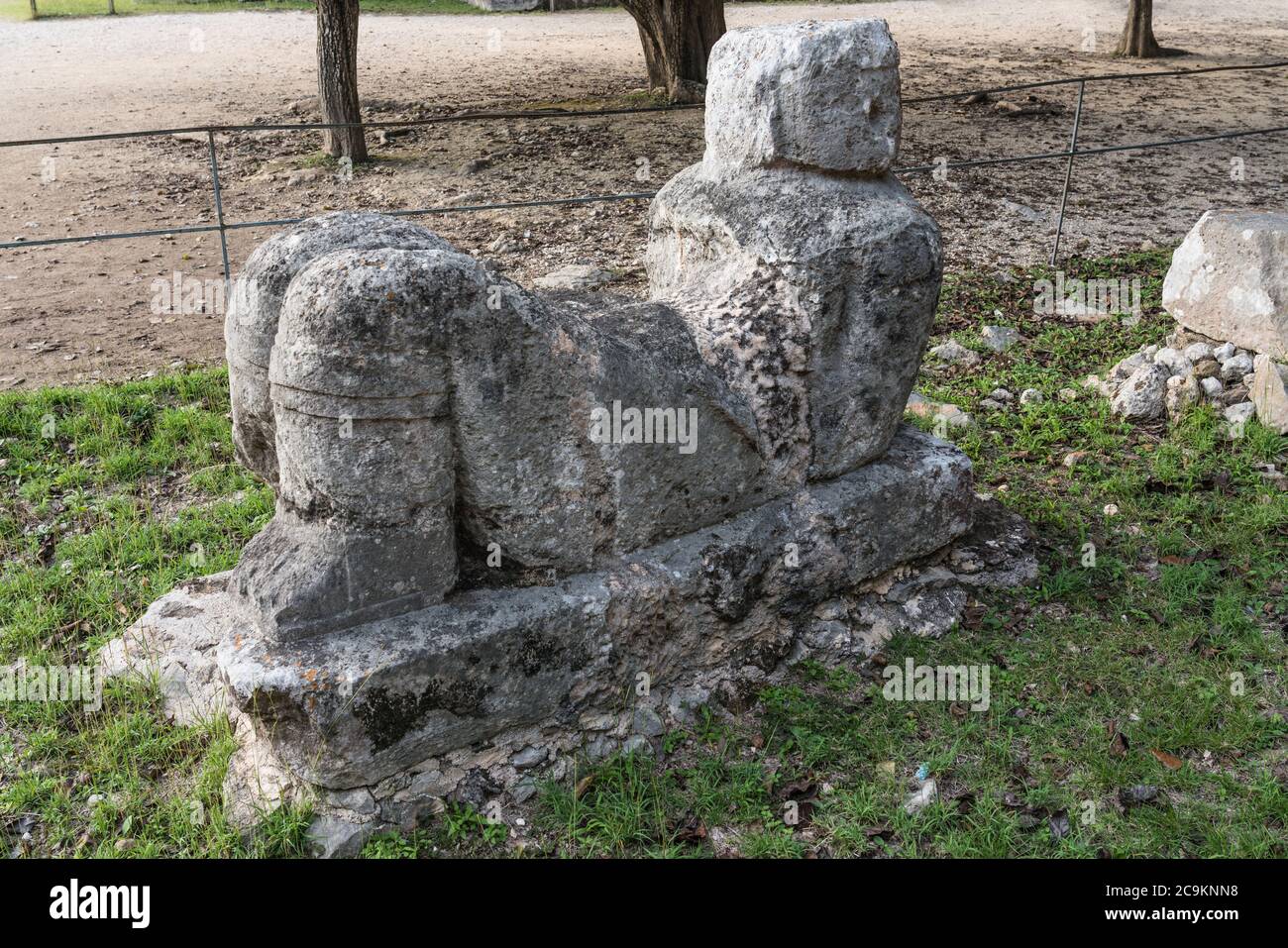 A statue of Chac Mool by the Platform of the Eagles and Jaguars in the ruins of the great  Mayan city of Chichen Itza, Yucatan, Mexico.  The Pre-Hispa Stock Photo