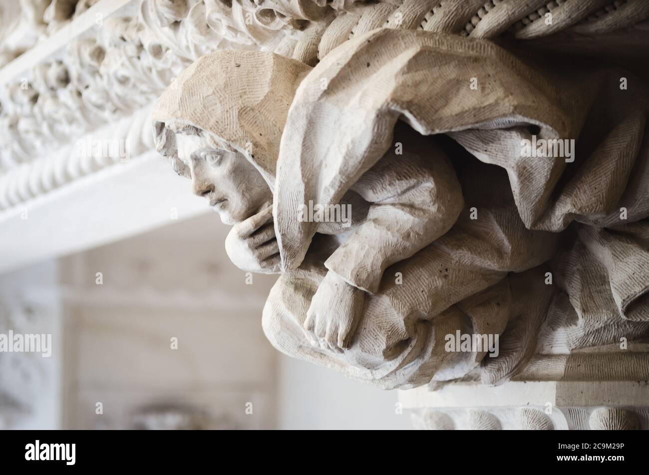 Sintra, Portugal - February 5 2019: Fireplace detail with hooded figure in Quinta da Regaleira Palace, masonic estate of the romantic age in Sintra, P Stock Photo