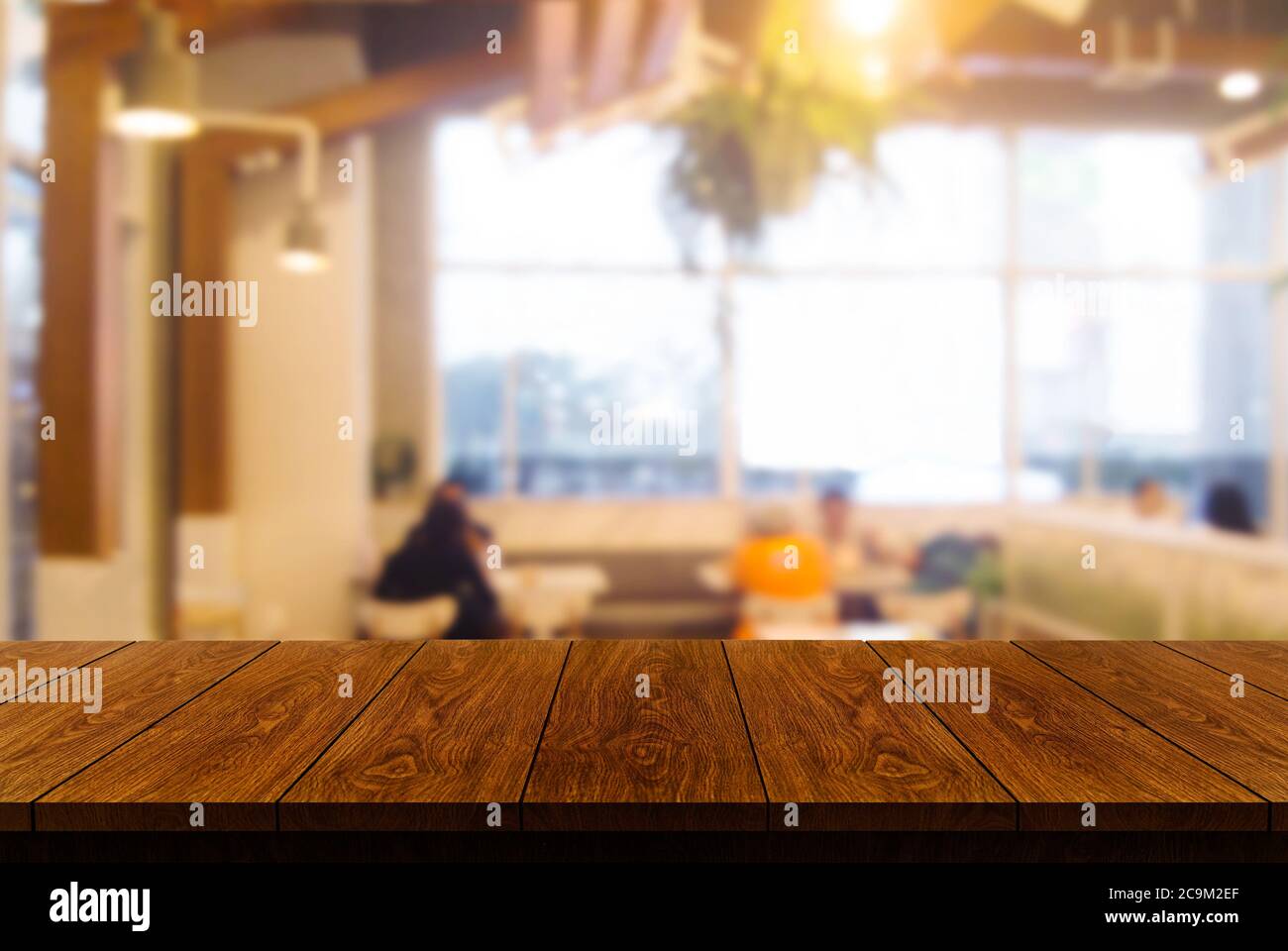 Wood table in blur background of modern restaurant Stock Photo