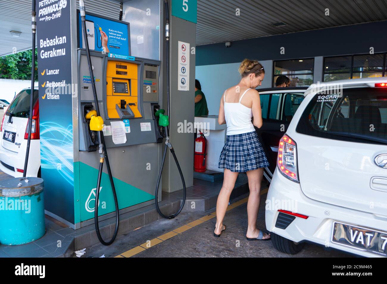 Car refueling at a petrol station in Malaysia. Stock Photo