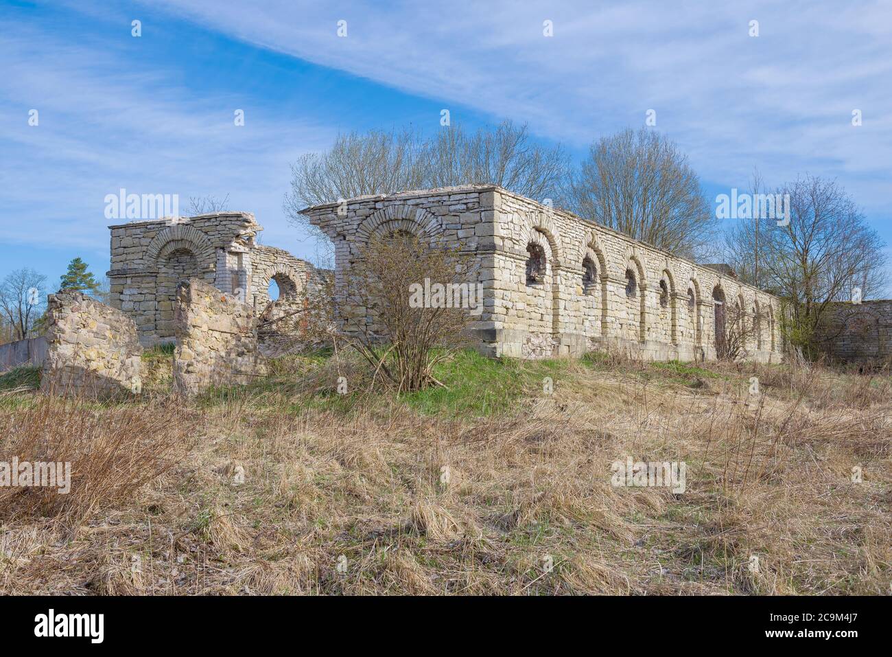 The ruins of an ancient stables building in the Dylitsy manor on a sunny April day. Elizavetino, Leningrad region. Russia Stock Photo