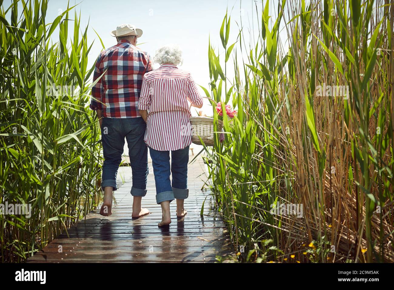 Old couple in love enjoys romantic moments on a sunny day Stock Photo