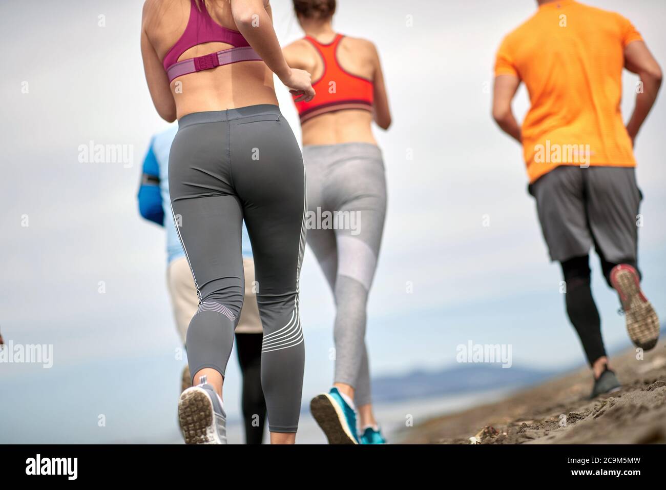 Exercise to the perfect body. Young girl jogging and exercises on the