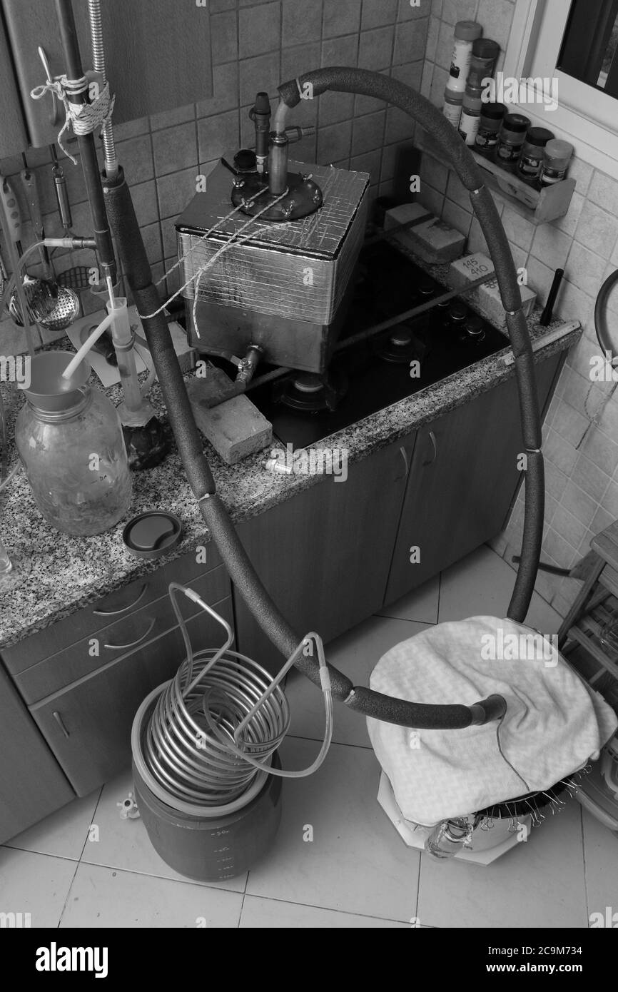 Beer stripping distillation of thick fruit mash  in a home kitchen by Steam Injection. Stock Photo