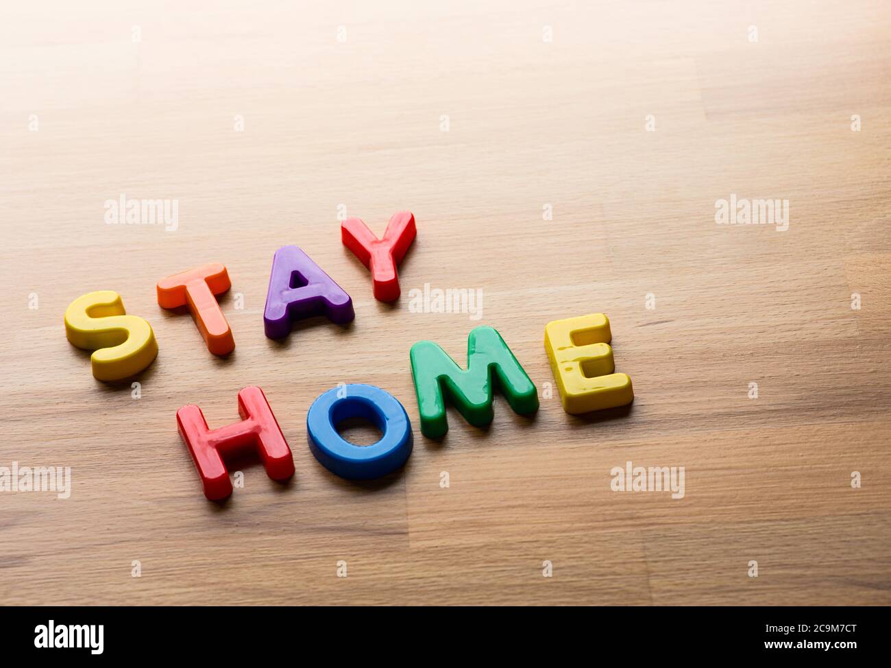Stay home concepts with colorful text message on wood table.New normal lifestyle and routine Stock Photo