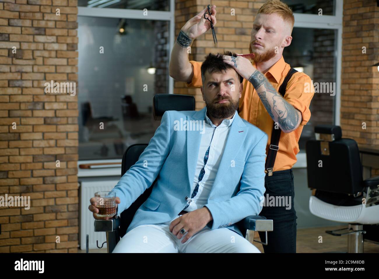 Razor blade. Barber Shaves and Trims. Hairdressers work for a handsome guy at the barber shop