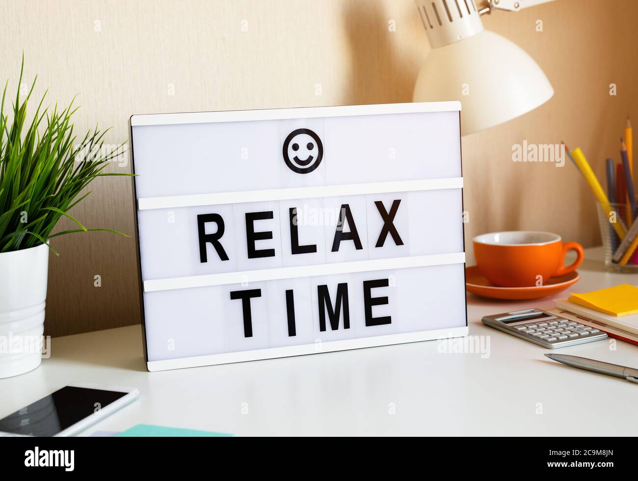 Relax time and work balance concepts with text on light box on desk table in home office.positive emotion to success.body healthy Stock Photo