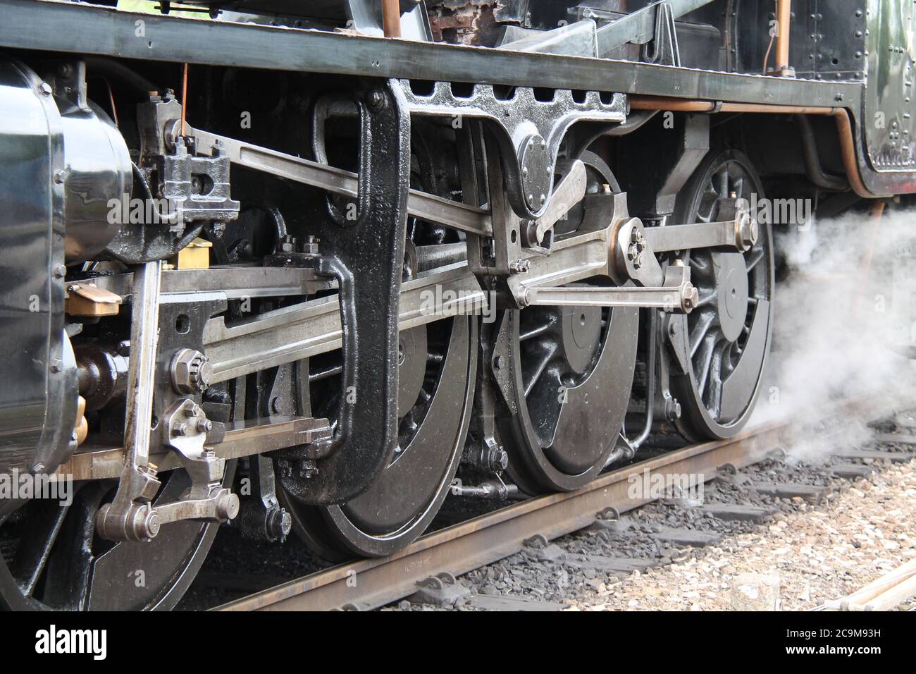 Wheels and Connecting Rods of a Steam Train Engine. Stock Photo