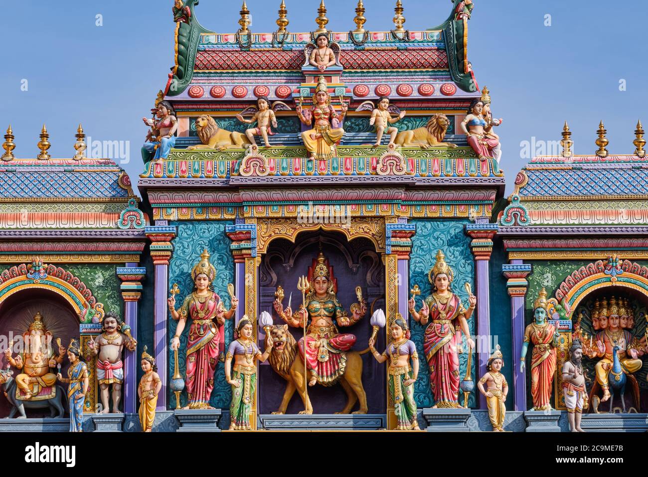 The South Indian-style gopuram (entrance tower) atop Sri Vadapathira Kaliammam Temple, with colorful figures of Hindu deities; Little India, Singapore Stock Photo