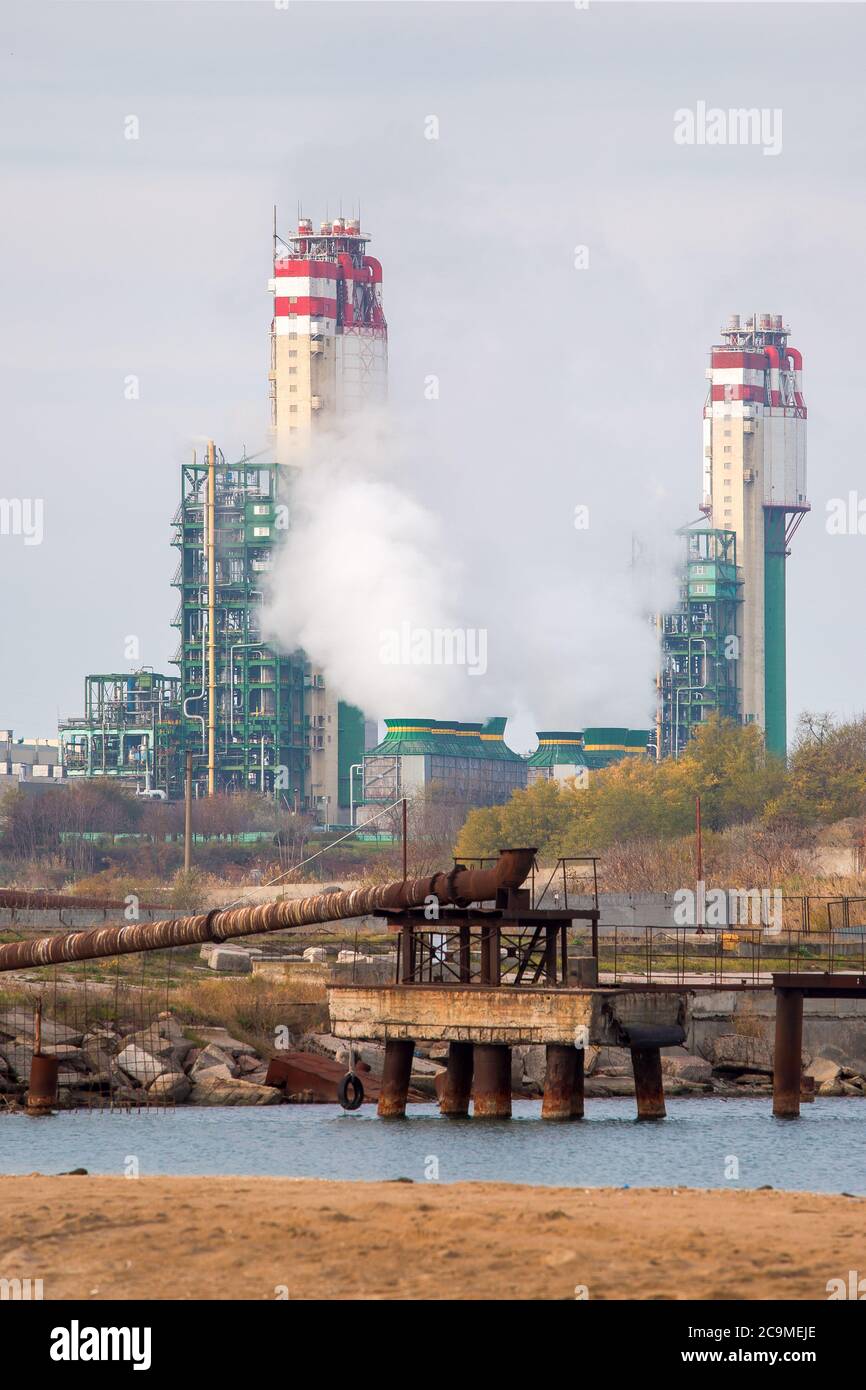 Chemical factory. Plant for production of ammonia and nitrogen fertilization. The steam from the cooling system. Stock Photo