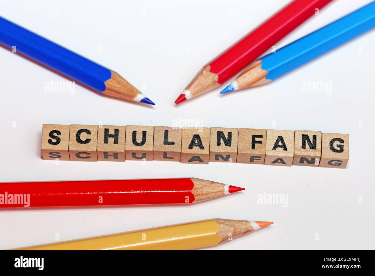 Symbol picture for the start of the new school year with letter cube and pens Stock Photo