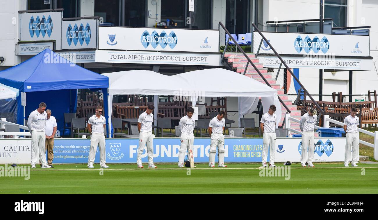 Brighton UK 1st August 2020 - Sussex players observe a minutes silence during day one of the cricket match between Sussex and Hampshire in the Bob Willis Trophy taking place behind closed doors with no fans attending at The 1st Central County Ground in Hove : Credit Simon Dack / Alamy Live News Stock Photo