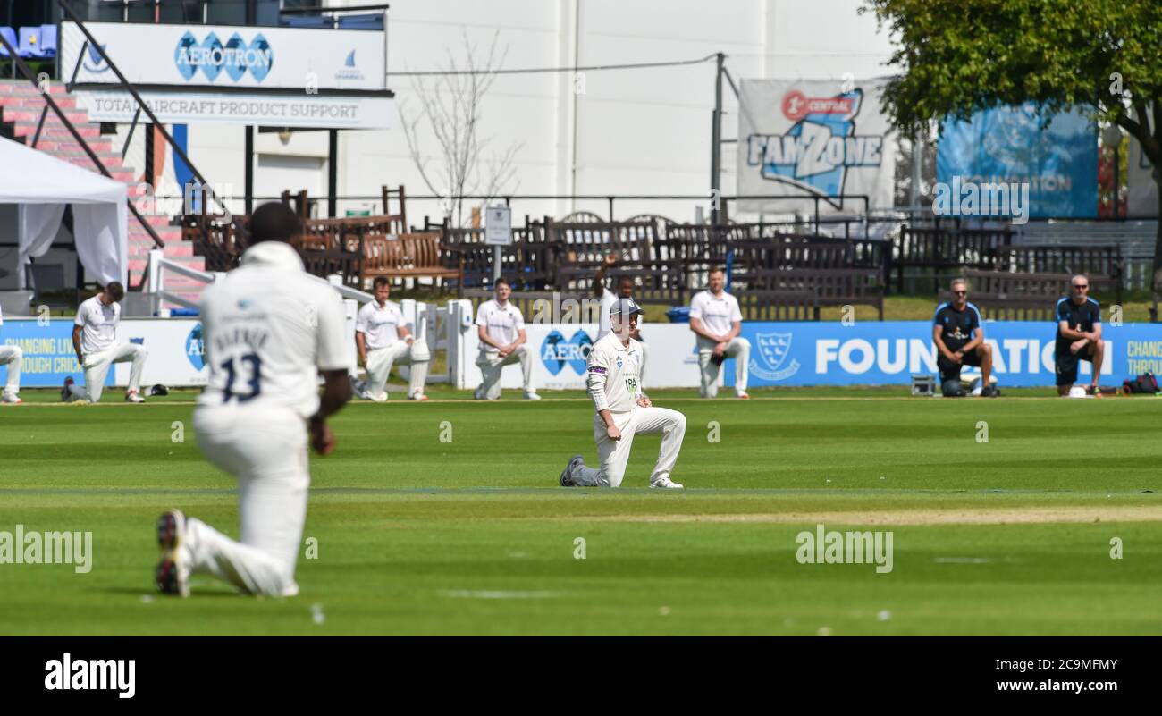 Brighton UK 1st August 2020 - The players take the knee during day one of the cricket match between Sussex and Hampshire in the Bob Willis Trophy taking place behind closed doors with no fans attending at The 1st Central County Ground in Hove : Credit Simon Dack / Alamy Live News Stock Photo