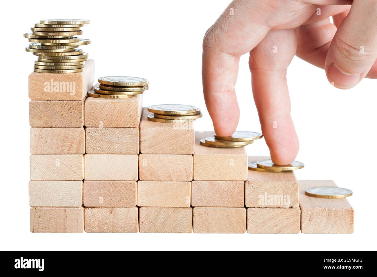 Fingers walking up on stacks of coins isolated on white background. Stock Photo