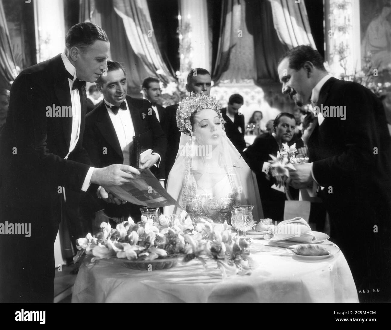 JESSIE MATTHEWS with BORIS RANEVSKI and ANTHONY HOLLES as waiters and TERRY-THOMAS as uncredited extra sitting at table behind at right in IT'S LOVE AGAIN 1936 director VICTOR SAVILLE costumes Joe Strassner Gaumont British Picture Corporation Stock Photo