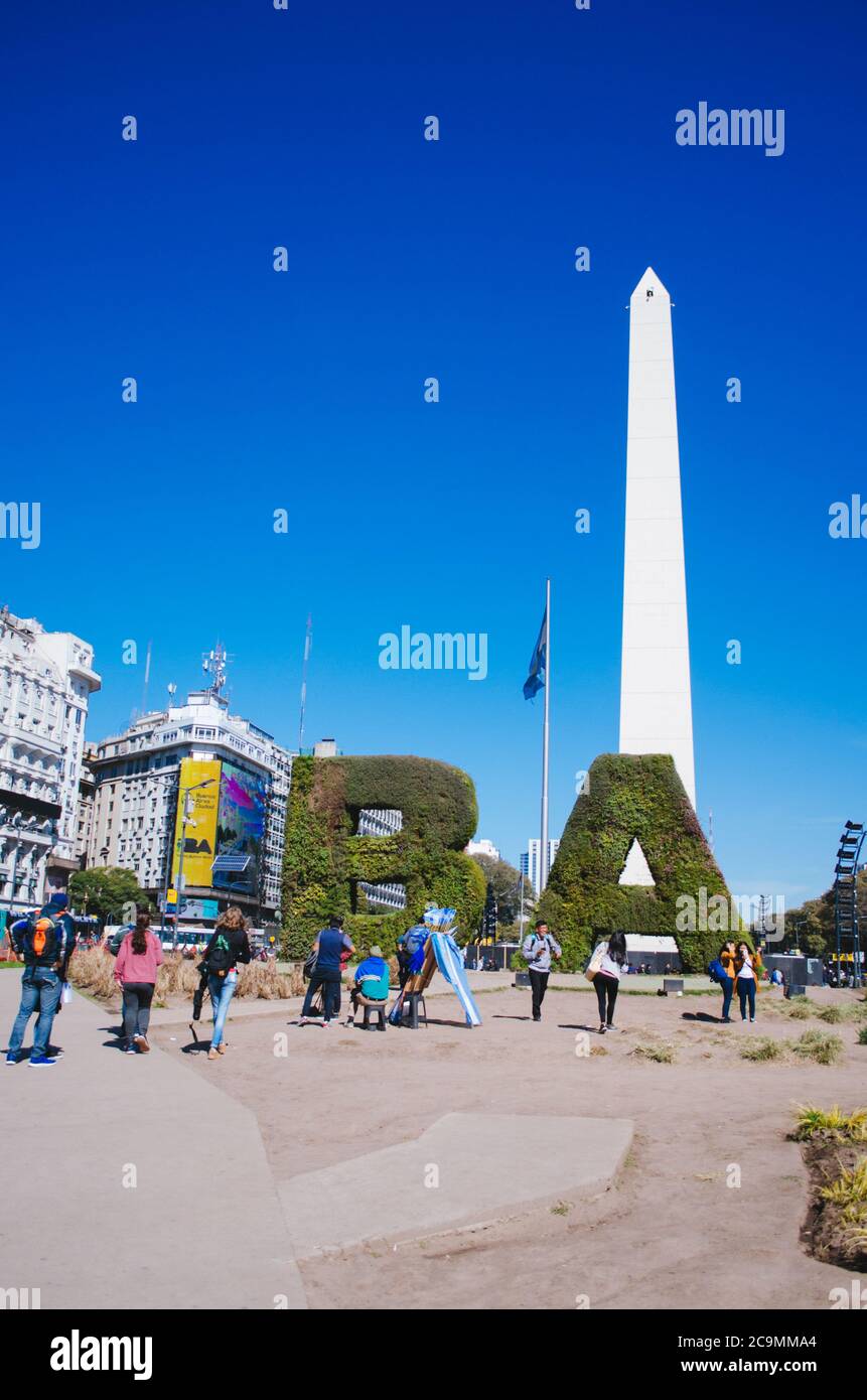 Buenos Aires, Argentina - September 4, 2018: Tourists in front of the famous argentinian Obelisk taking selfies and group pictures. Stock Photo