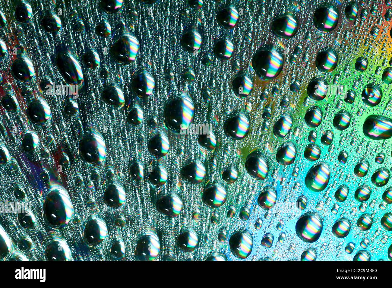 Macro of water drops on multicolor background Stock Photo - Alamy