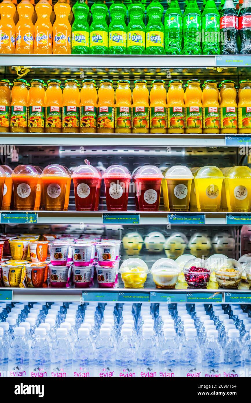 DOHA, QATAR FEB 28, 2020 Cooled drinks and fruits displayed in a commercial refrigerator