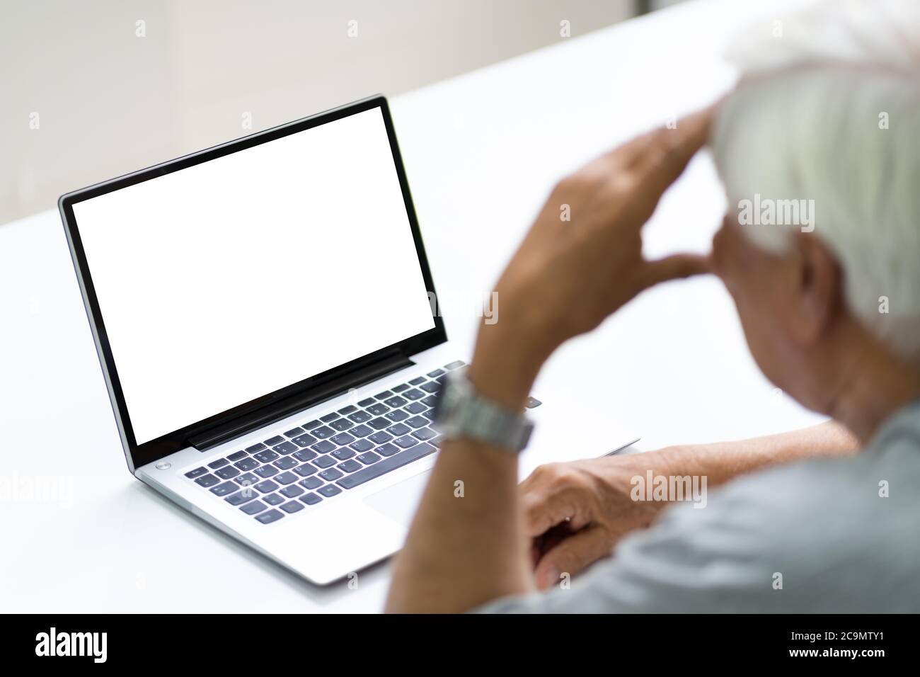 Stressed Senior Having Errors On His Broken Laptop Stock Photo