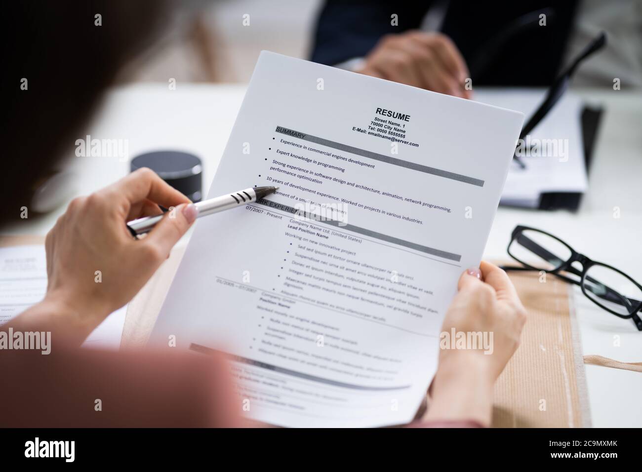 Reading Resume And Recruitment Application At Job Interview Stock Photo