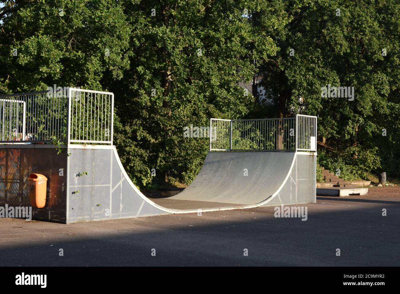 Skateboard ramp made from aluminium and wood in school playground without people due to coronavirus and Covid-19 Measurement to keep social distancing. Stock Photo