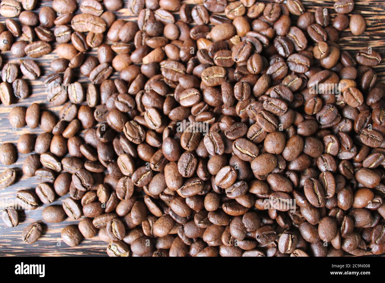 Closeup of whole dark roasted coffee beans Stock Photo