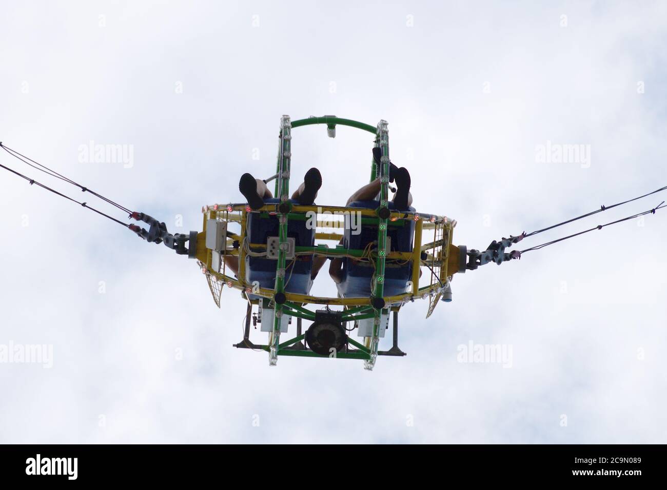 Varna, Bulgaria - June, 26, 2020: two people on the bungee ride bottom view. Stock Photo