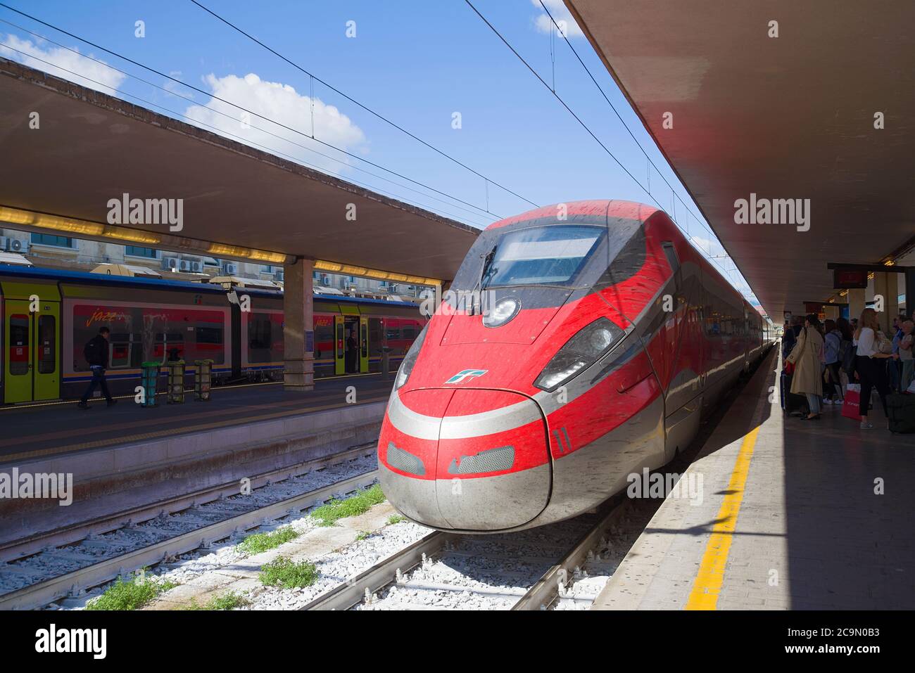 FLORENCE, ITALY - SEPTEMBER 25, 2017: The high-speed passenger train Frecciarossa ETR.1000 of the Trenitaliya company has arrived to the central railw Stock Photo