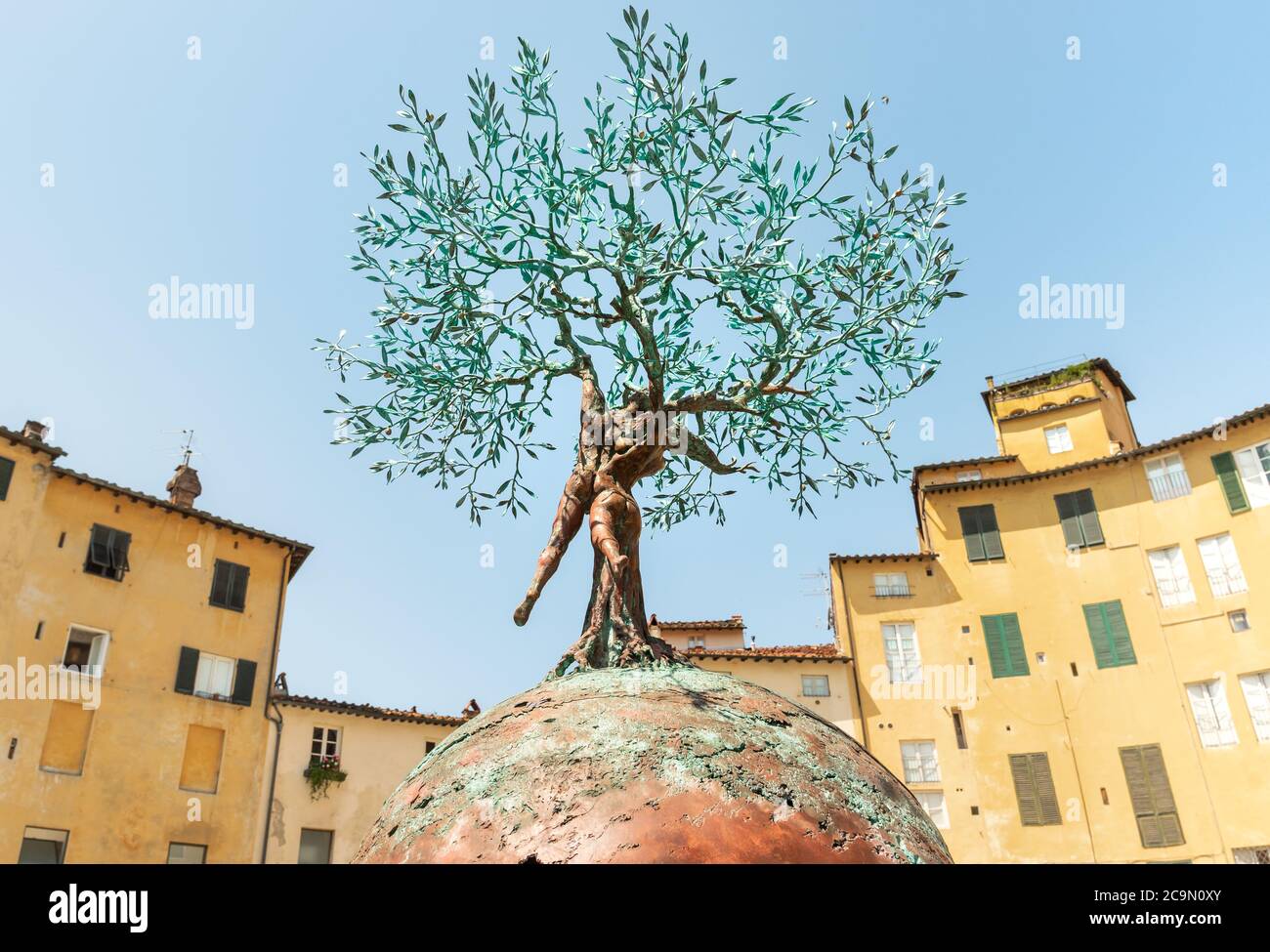 Bronze sculpture of the Tree of Life of Andrea Roggi in the Amphitheater square in old town Lucca, Tuscany, Italy Stock Photo