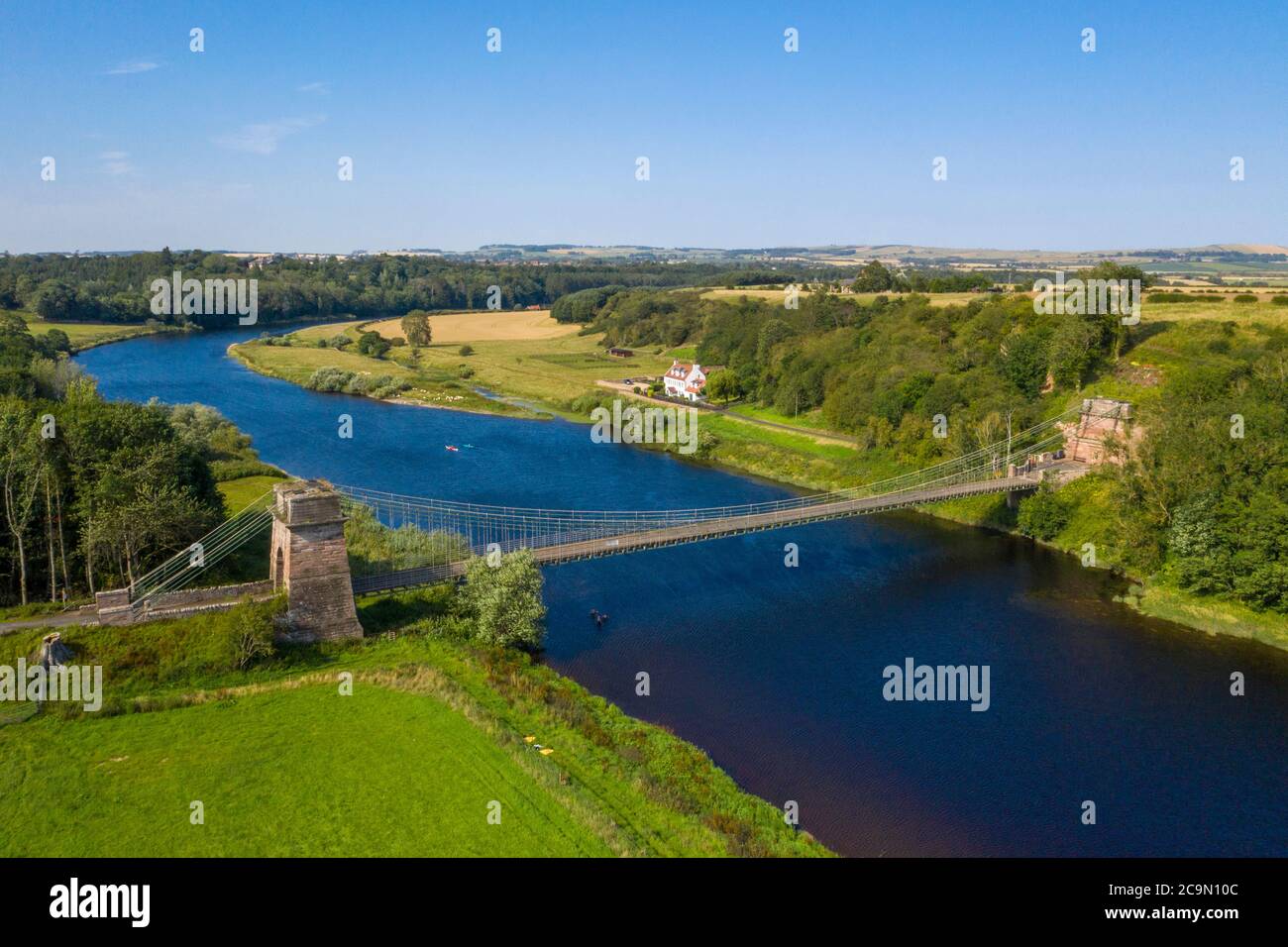 The Union Suspension Bridge which spans the river Tweed between Horncliffe, Northumberland, England and Fishwick, Scottish Borders, Scotland. Stock Photo
