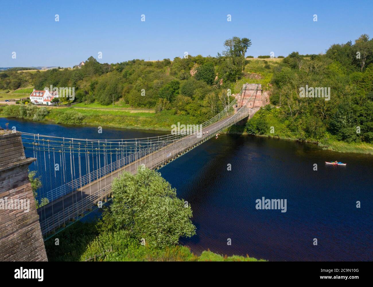 The Union Suspension Bridge which spans the river Tweed between Horncliffe, Northumberland, England and Fishwick, Scottish Borders, Scotland. Stock Photo