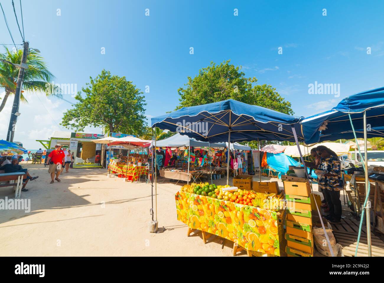 Guadeloupe, FR - February 17, 2019: Fruits and souvenirs stands in Guadeloupe, French west indies. Lesser Antilles, Caribbean sea Stock Photo
