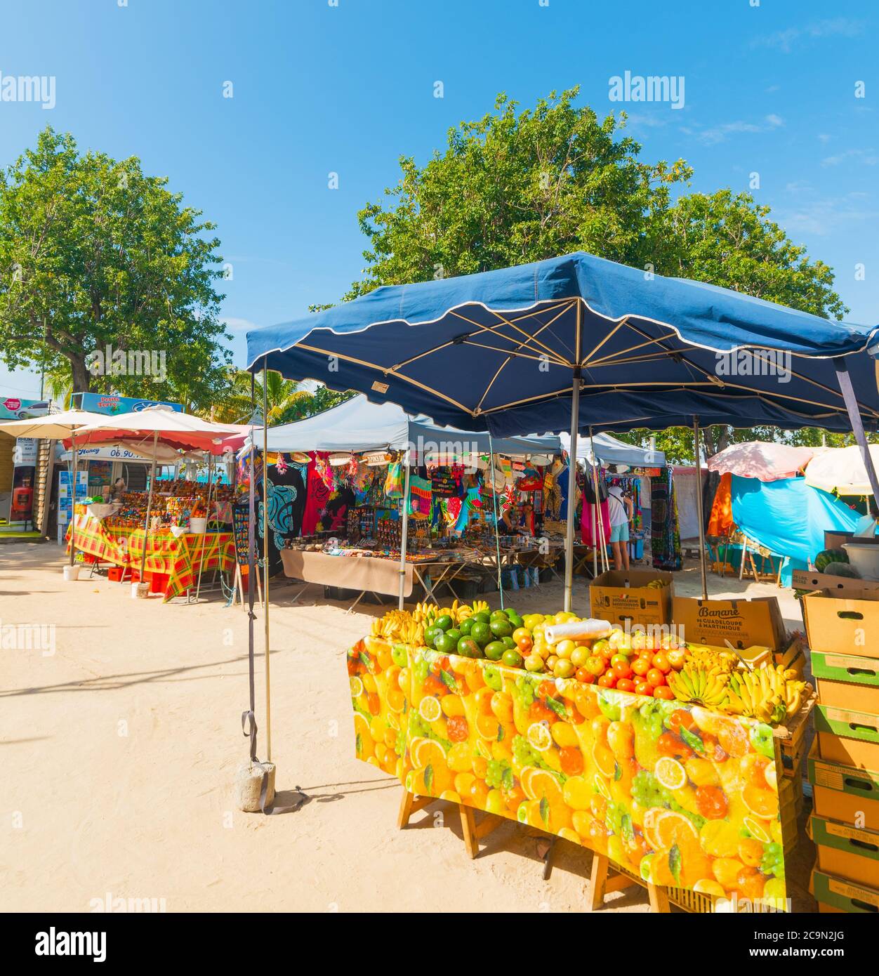 Guadeloupe, FR - February 17, 2019: Fruits and souvenirs stands in Guadeloupe, French west indies. Lesser Antilles, Caribbean sea Stock Photo