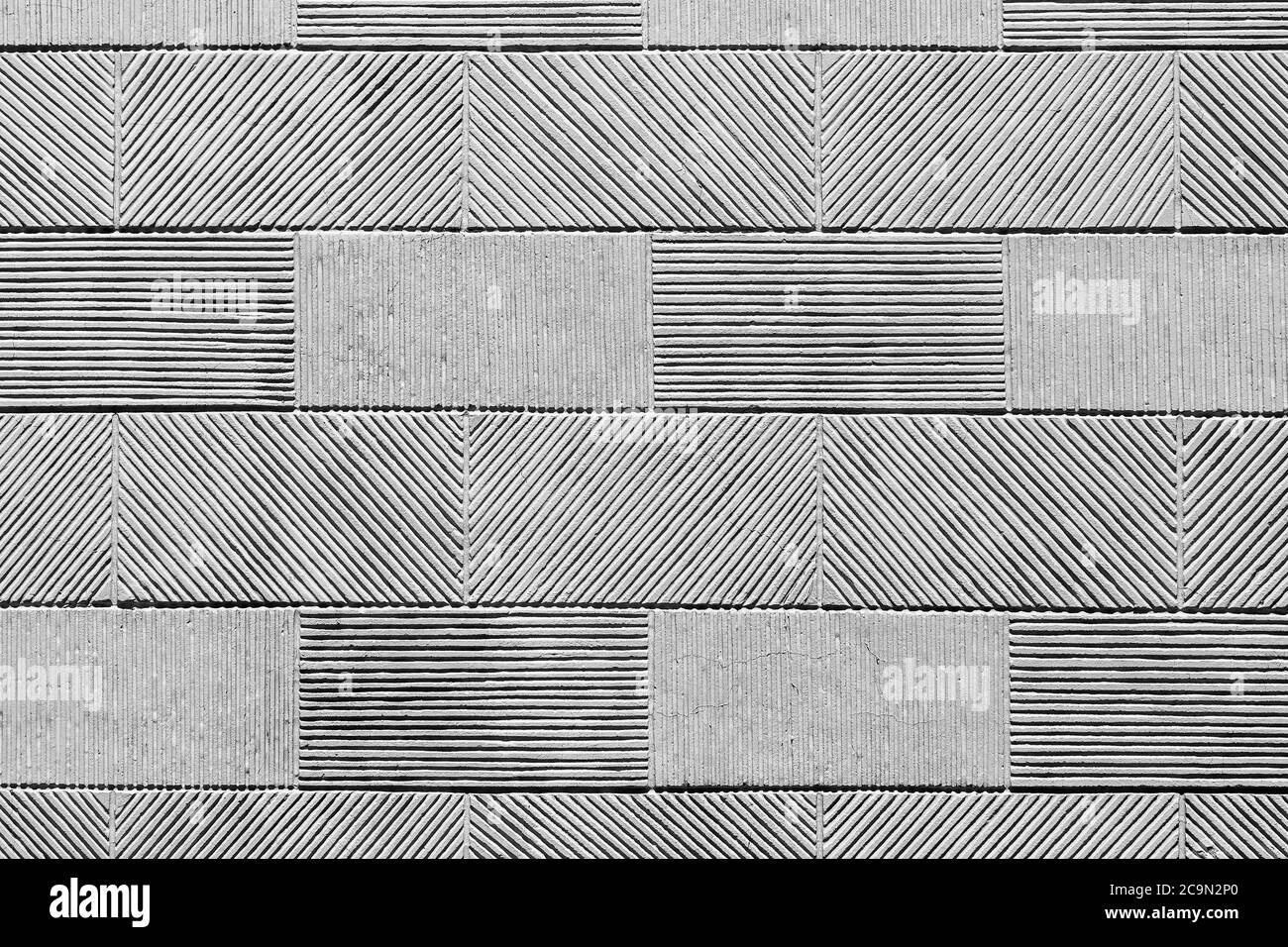 Texture of a wall from a stone tile, a striped pattern of a rectangular tile. Stock Photo