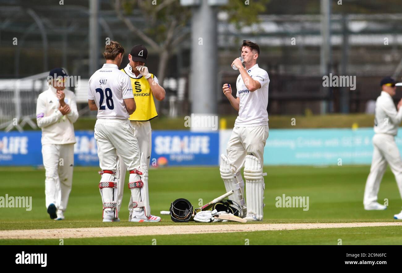 Brighton UK 1st August 2020 - Sussex batter George Garton takes a drink during day one of the cricket match between Sussex and Hampshire in the Bob Willis Trophy taking place behind closed doors with no fans attending at The 1st Central County Ground in Hove : Credit Simon Dack / Alamy Live News Stock Photo