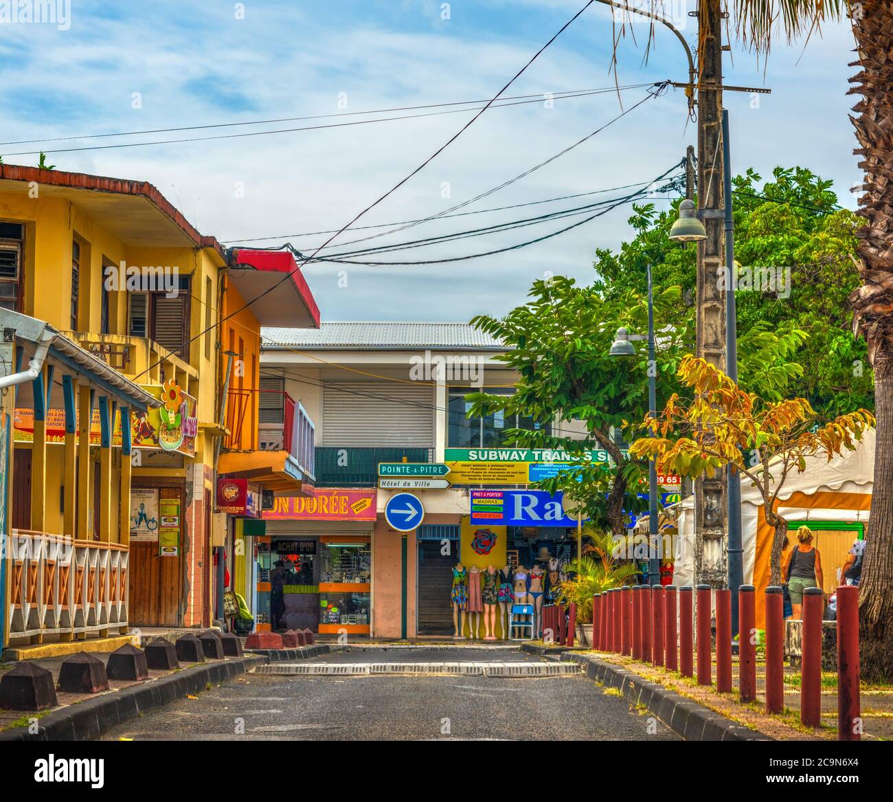 Guadeloupe, FR - February 15, 2019: Narrow street in a small village in Guadeloupe, French west indies. Lesser Antilles, Caribbean Stock Photo