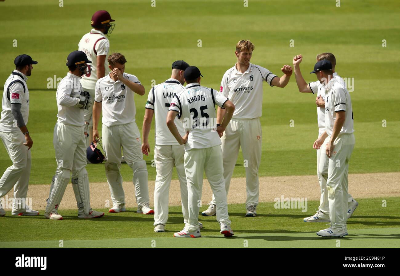 Warwickshire's Alex Thomson (second right) celebrates taking the wicket of Northamptonshire's Ben Sanderson during day one of the Bob Willis Trophy match at Edgbaston, Birmingham. Stock Photo