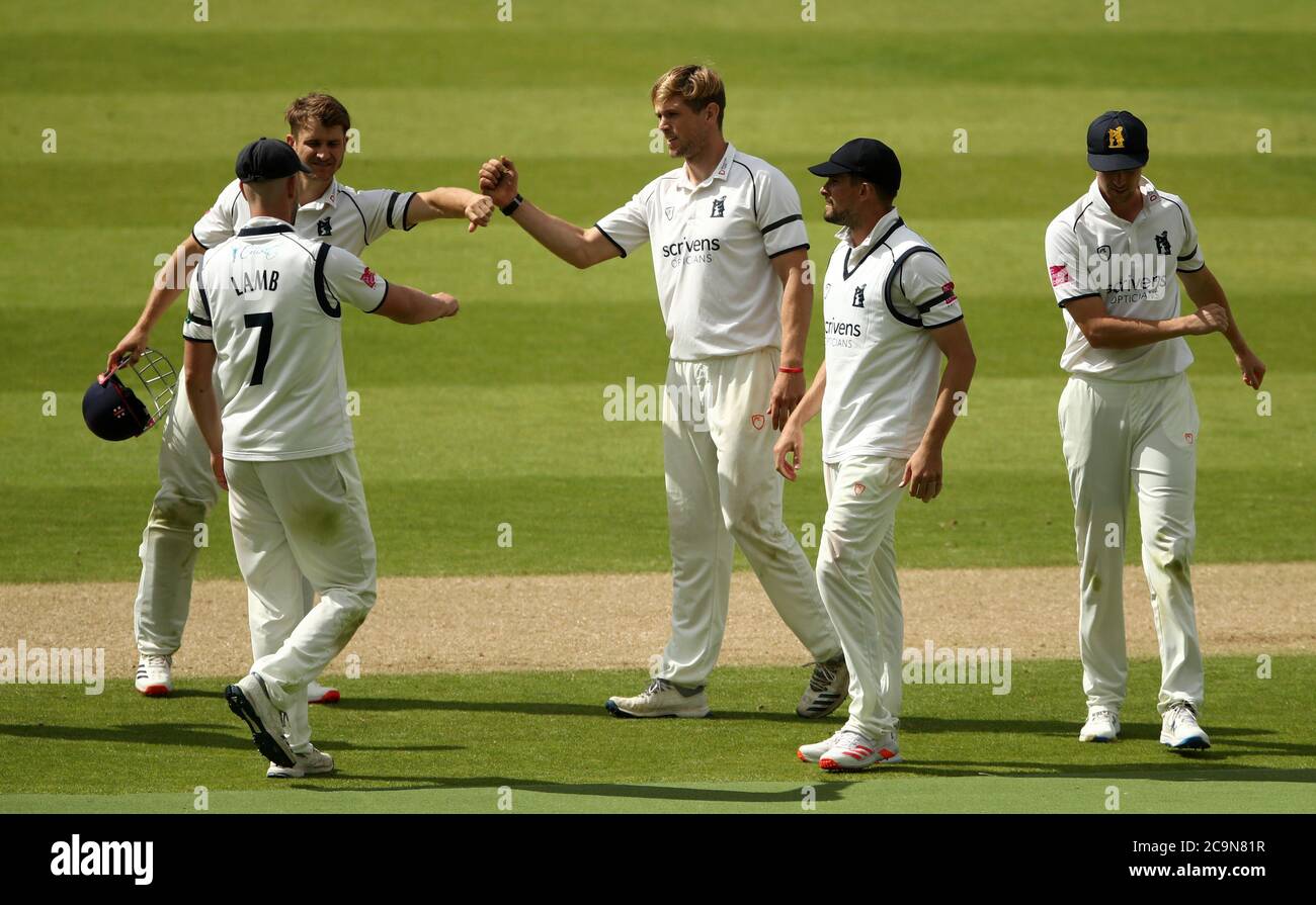 Warwickshire's Alex Thomson (centre) celebrates taking the wicket of Northamptonshire's Ben Sanderson during day one of the Bob Willis Trophy match at Edgbaston, Birmingham. Stock Photo