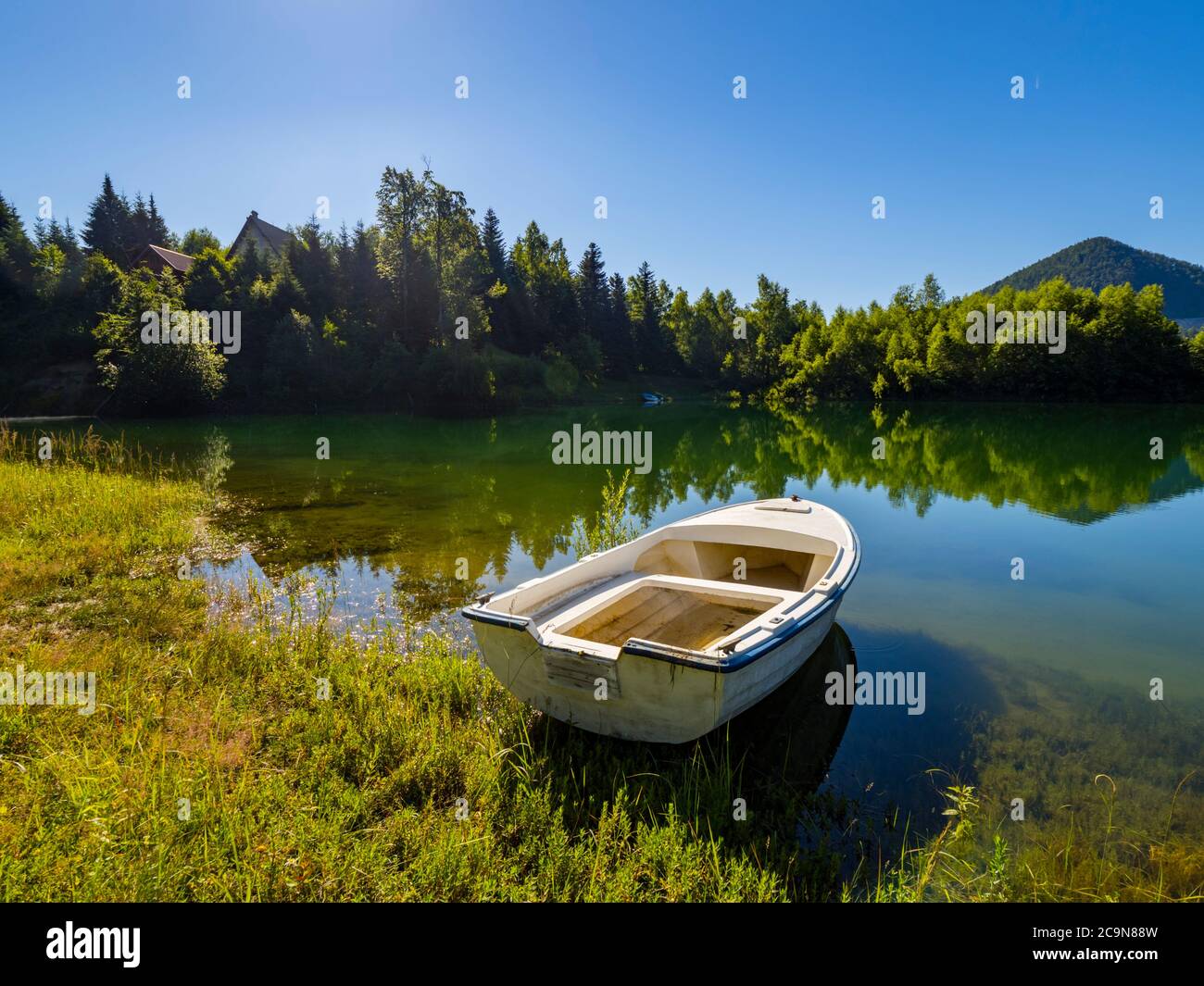 Lonely boat moored beautiful nature of Lokve lake in Croatia Europe Stock Photo